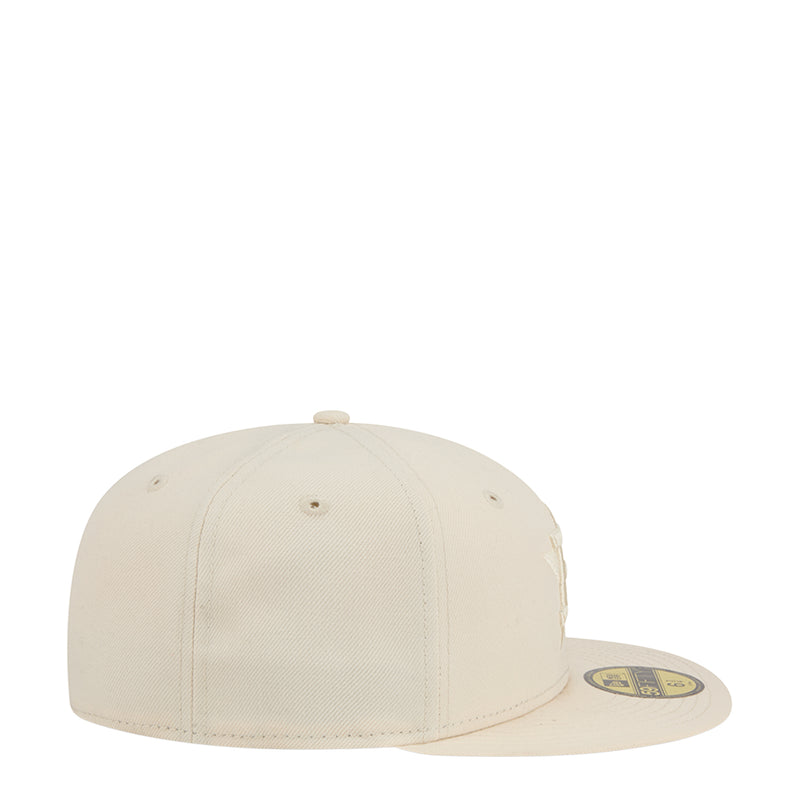 Light cream baseball cap, side view with small eyelets and curved brim