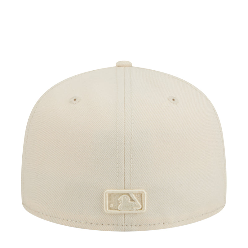 Light cream baseball cap with tonal embroidered emblem on front panel