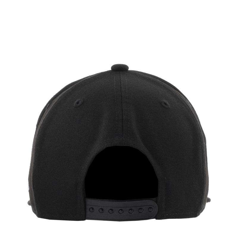 Black baseball cap back view with adjustable strap and metal eyelets