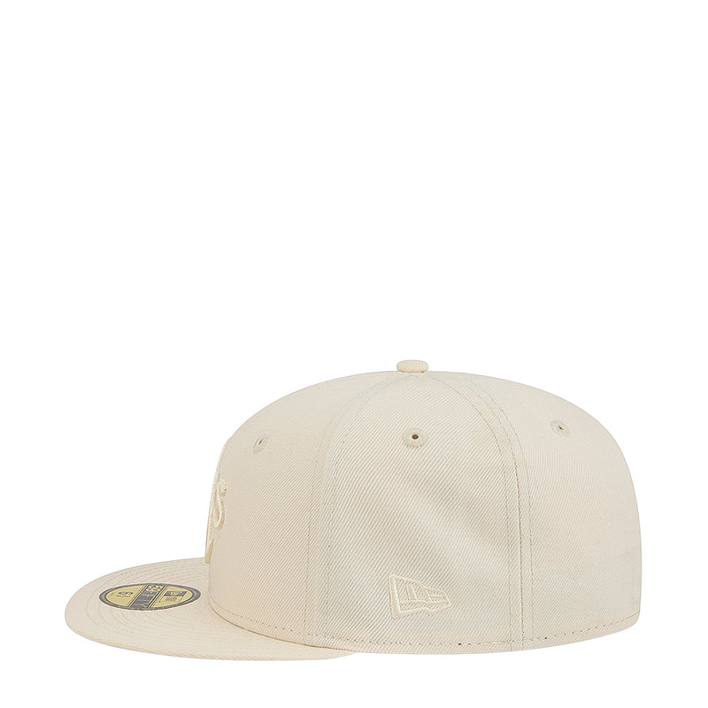 Light cream baseball cap with tonal emblem on front crown and curved brim