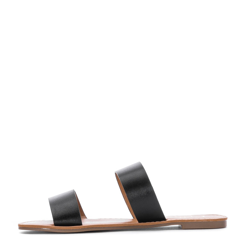 Women's black two-band slide sandal with tan sole and stacked straps