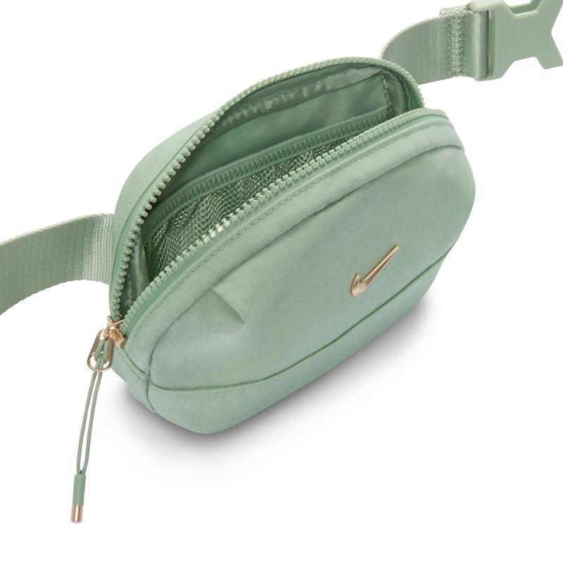 Light green Aura oval crossbody bag open view, zip pocket and adjustable strap