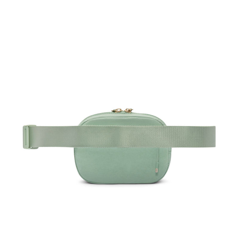 Light green Aura oval crossbody bag with adjustable strap across the front