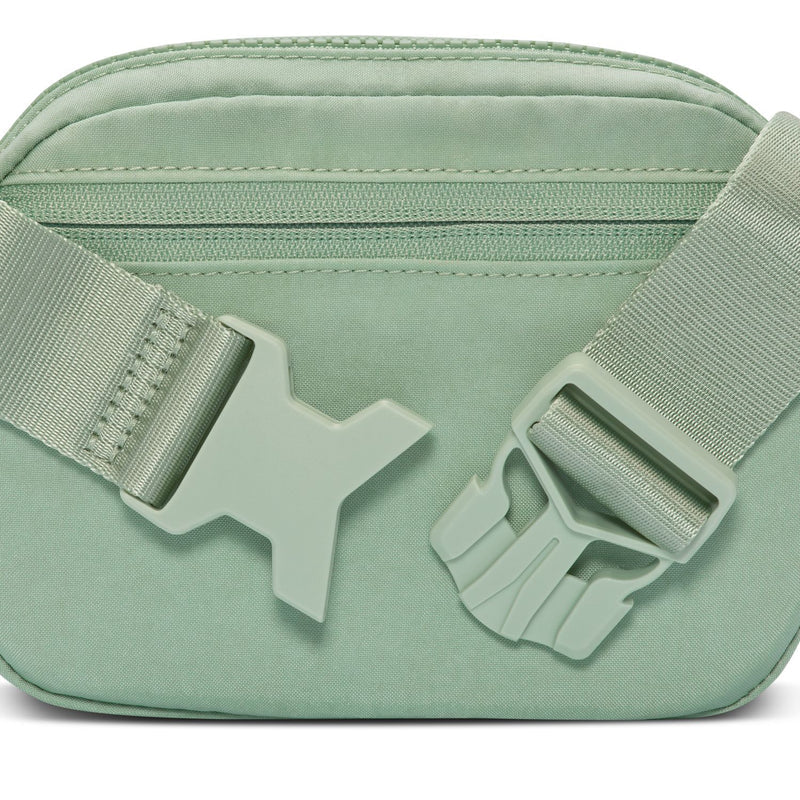 Light green Aura oval crossbody bag with star-shaped strap adjuster and zip top