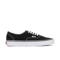 Men's black canvas sneakers with white stitching, white laces, and logo patch