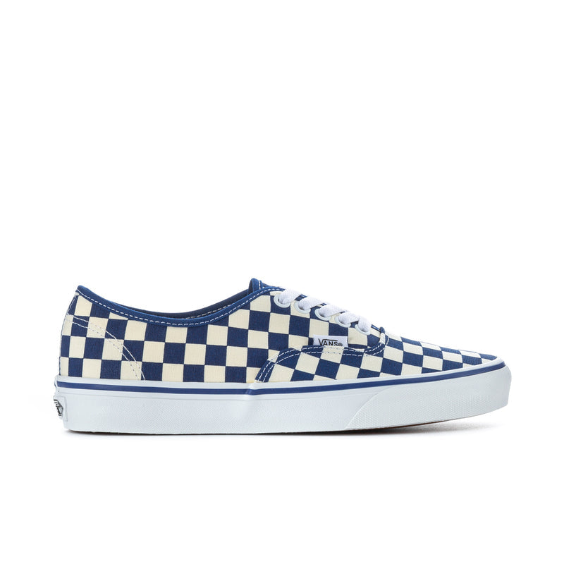 Low-top checkerboard sneakers with blue and white canvas uppers, lace-up