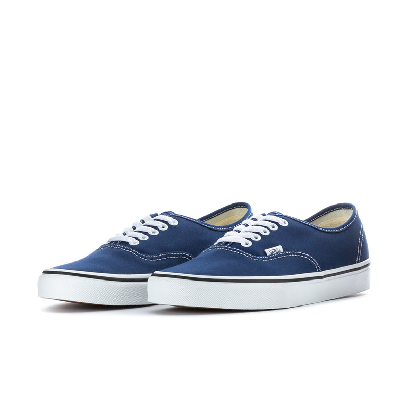 Pair of men's blue canvas low-top sneakers with white laces and soles