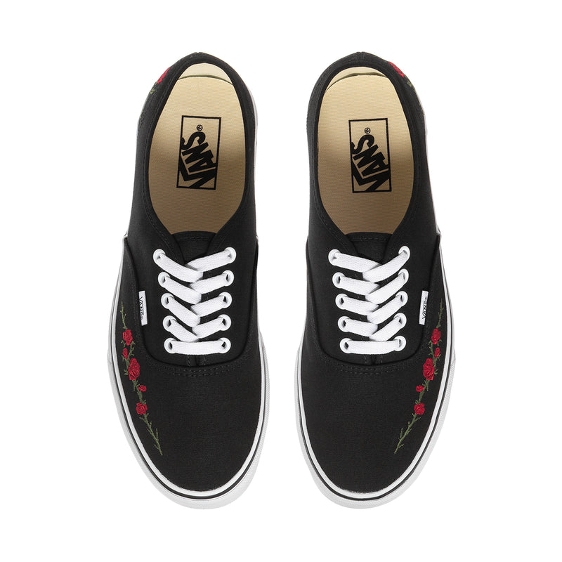 Men's black canvas sneakers front view with white laces and rose embroidery