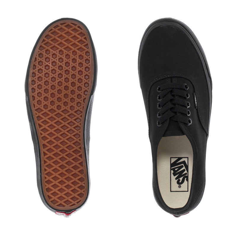 Black sneaker outsole with brown waffle tread; Vans logo on black sockliner