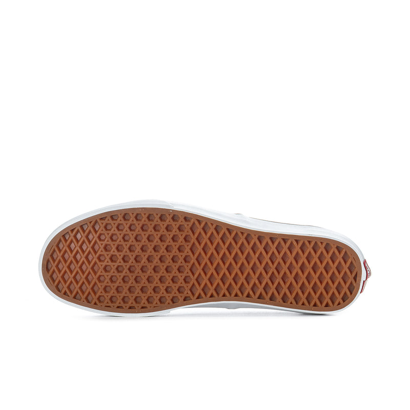 Men's sneaker outsole with brown tread and white rubber sidewall
