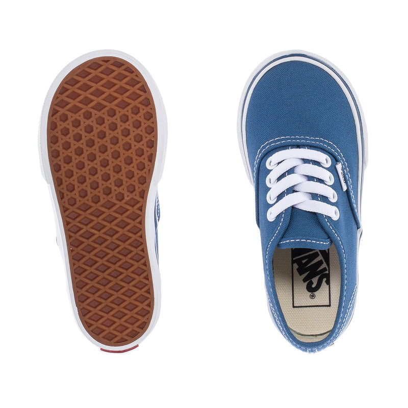 Toddler canvas sneakers showing brown treaded outsole and navy interior with VANS tag