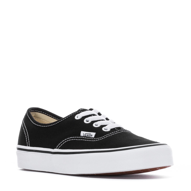 Black low-top canvas sneaker with white laces and Vans tongue label