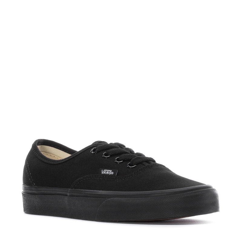 Black youth low-top sneakers with lace-up front and Vans logo, interior lining visible