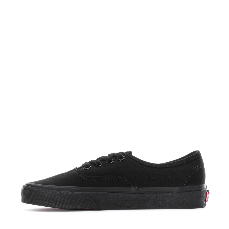 Black youth low-top sneaker side view with Vans logo and textured rubber sole