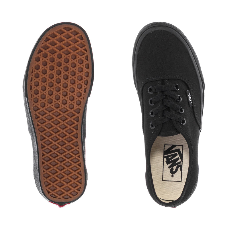 Black youth sneakers outsole with gum tread and Vans logo on insole