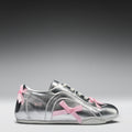 Silver sneaker with pink bows on a gray background