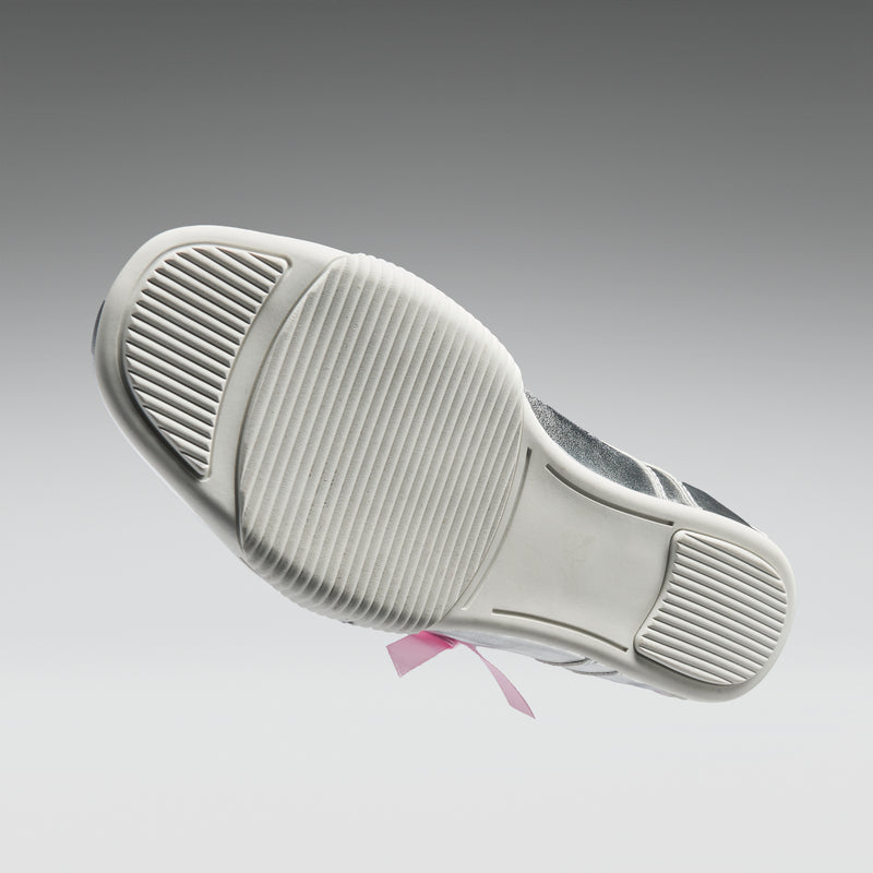 Close-up of a white sneaker sole with a gray background
