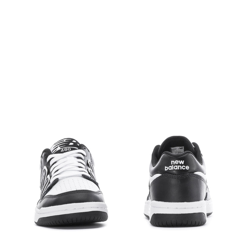 Youth New Balance sneakers, heel view with new balance text and black outsole