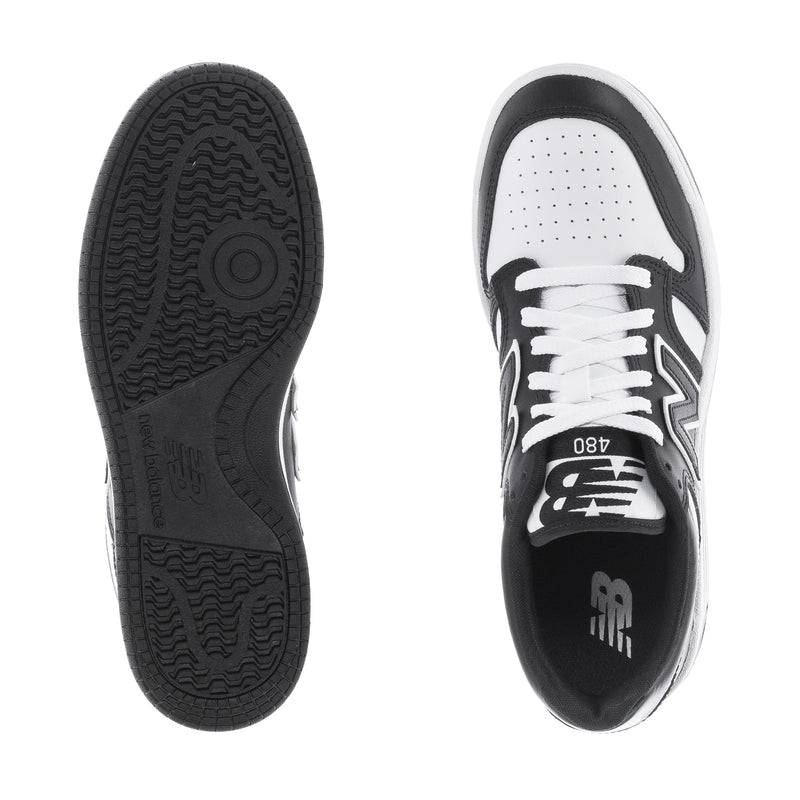 Youth New Balance sneakers, black rubber outsole and white perforated inner