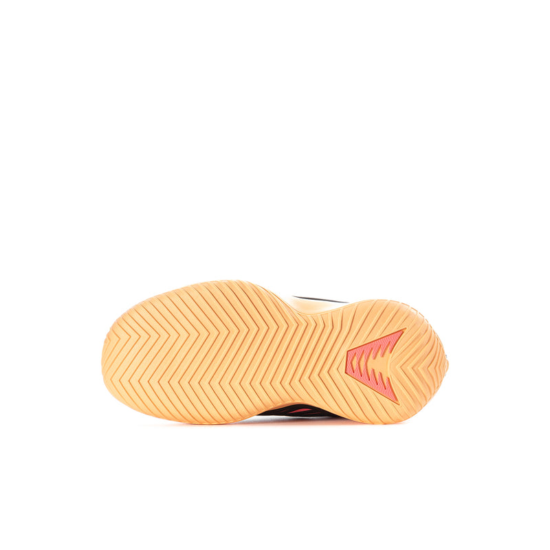 Kids athletic shoe outsole in light tan with pink forefoot logo