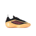 Youth sneakers with black upper, peach sole, and pink stripe logo on side