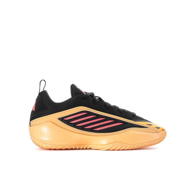 Youth sneakers with black upper, peach sole, and pink stripe logo on side