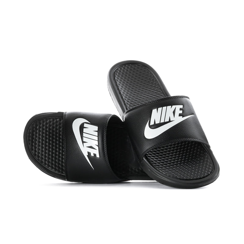 Black Nike slides with textured footbed and wide cross strap