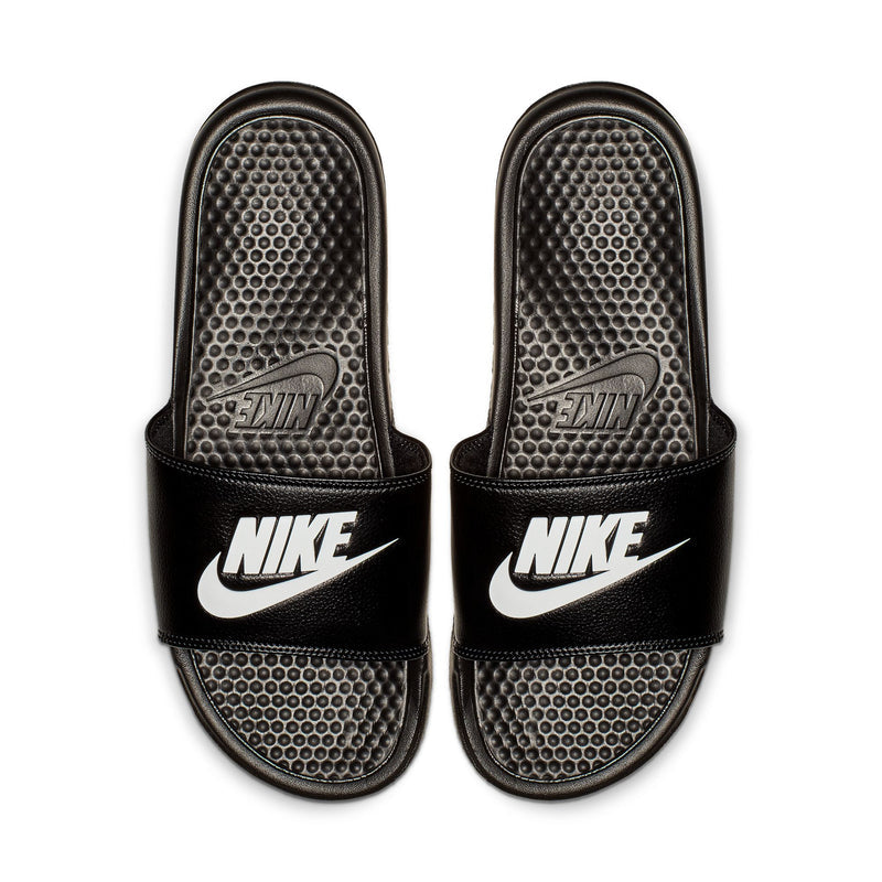 Pair of black Nike slides with studded footbed and white Nike branding