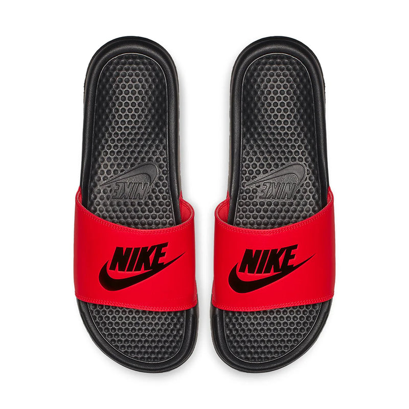 Pair of red slide sandals with black textured footbeds and Nike logos