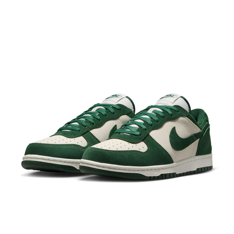 Men's Nike low-top sneakers, side view with dark green suede panels and cream toe