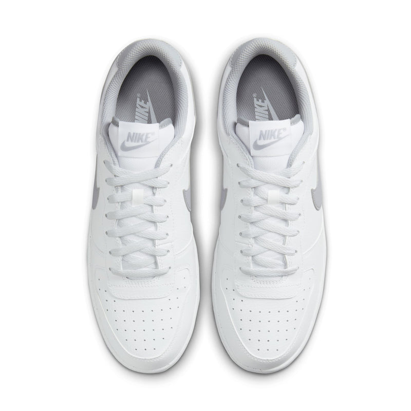 Pair of white Nike low-top sneakers with gray lining and lace-up front