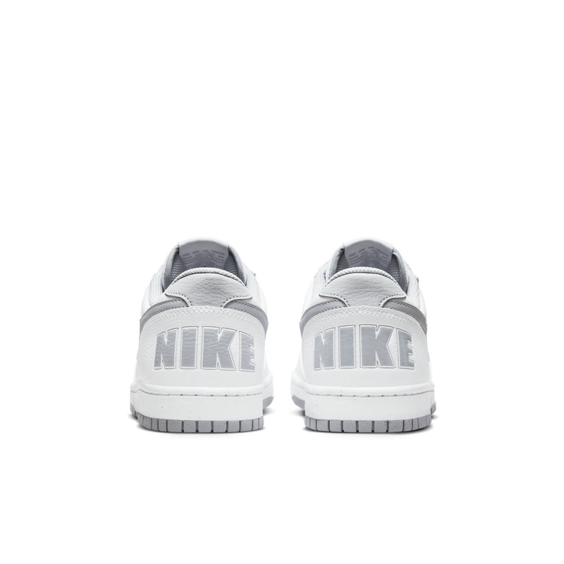 White Nike low-top sneakers showing rear heel and NIKE branding