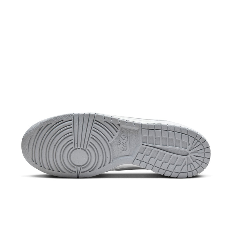White Nike sneaker outsole with textured tread and circular pivot pattern