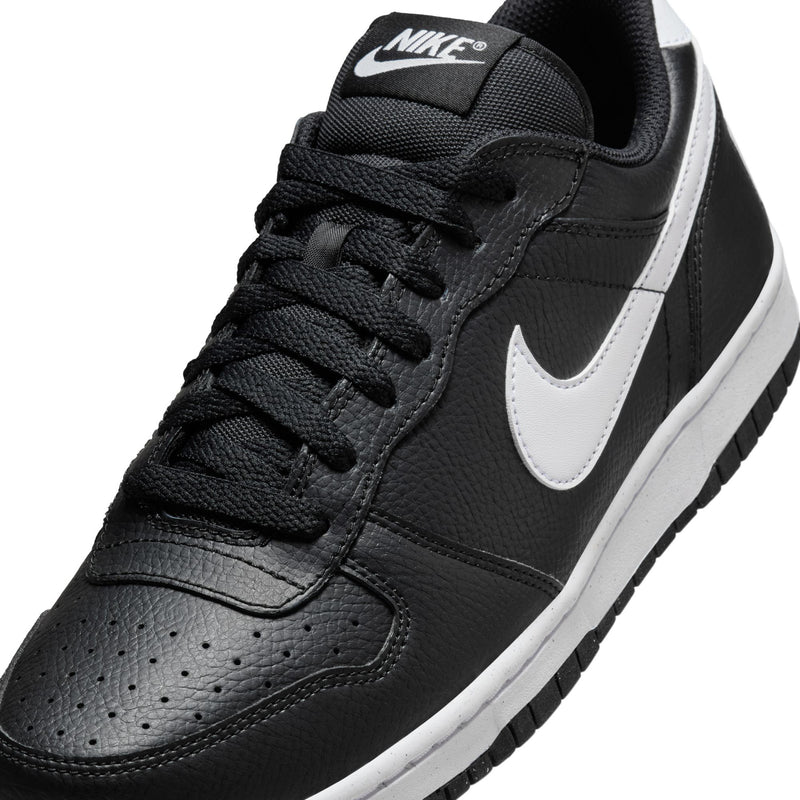Close-up of men's black low-top sneaker with white Swoosh and stitched toe box