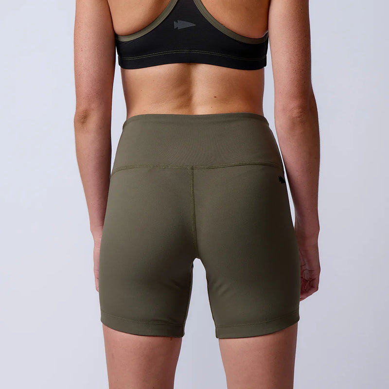 Back view of woman wearing GORUCK olive green rucking shorts and black sports bra