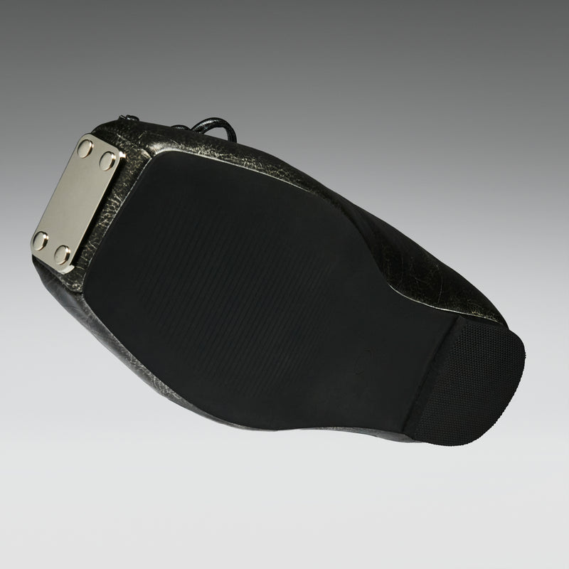 Black leather belt with silver buckle on a gray background