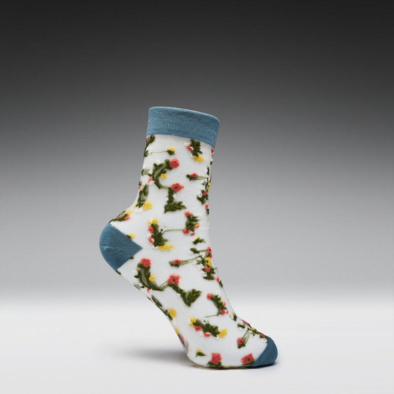 Floral-patterned sock with blue accents on a gray background