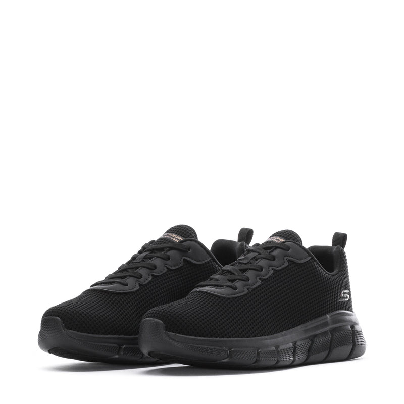Pair of women's black lace-up sneakers with rounded toe and rubber tread sole