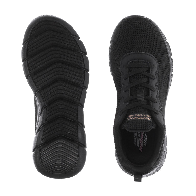 Women's black sneaker outsole and heel view with deep traction tread