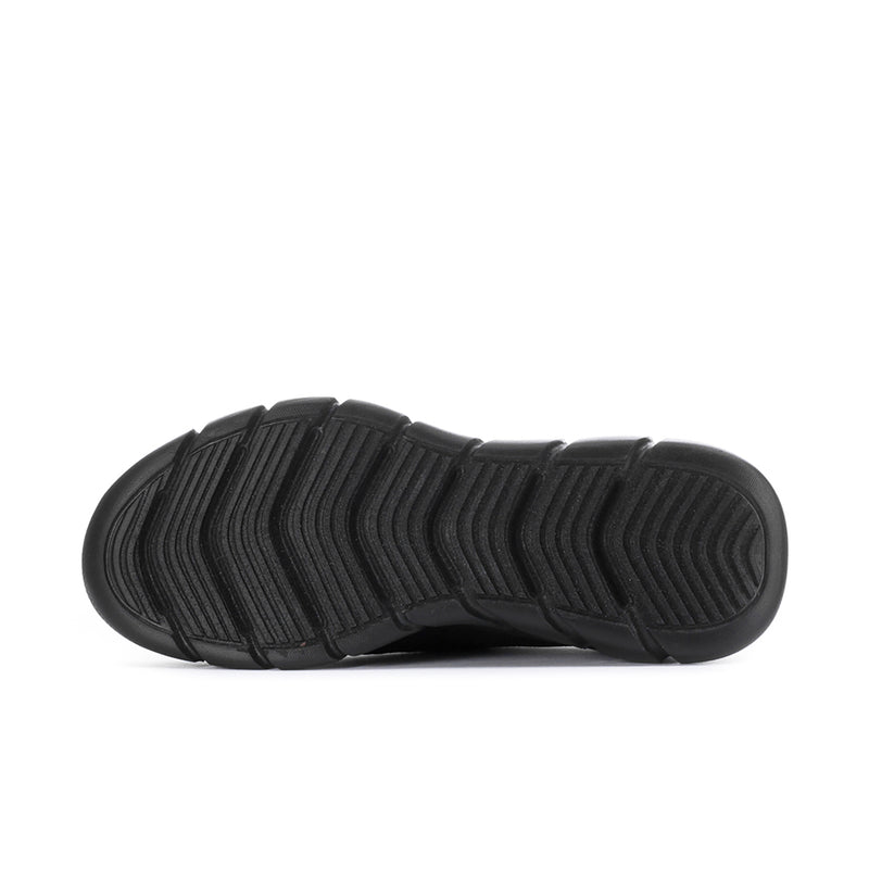 Black slip-on sneaker outsole with deep traction tread pattern