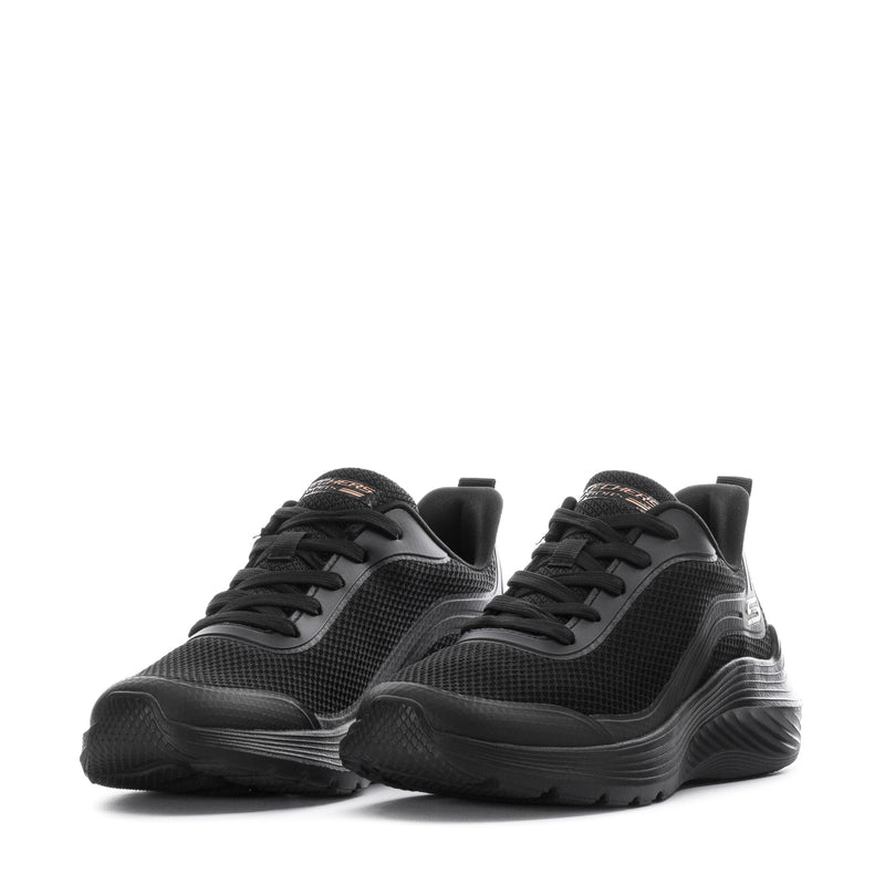 Black pair of lace-up athletic sneakers with textured uppers and chunky low sole