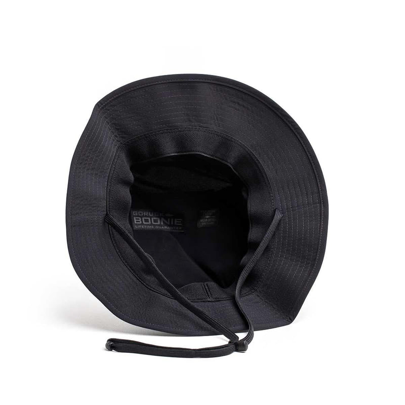Black GORUCK Boonie Hat with chin strap, tough rucking gear, top view on white background.