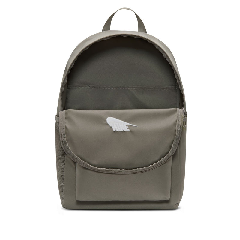 Nike Brasilia Heritage backpack with top opening, rounded flap, and white logo patch
