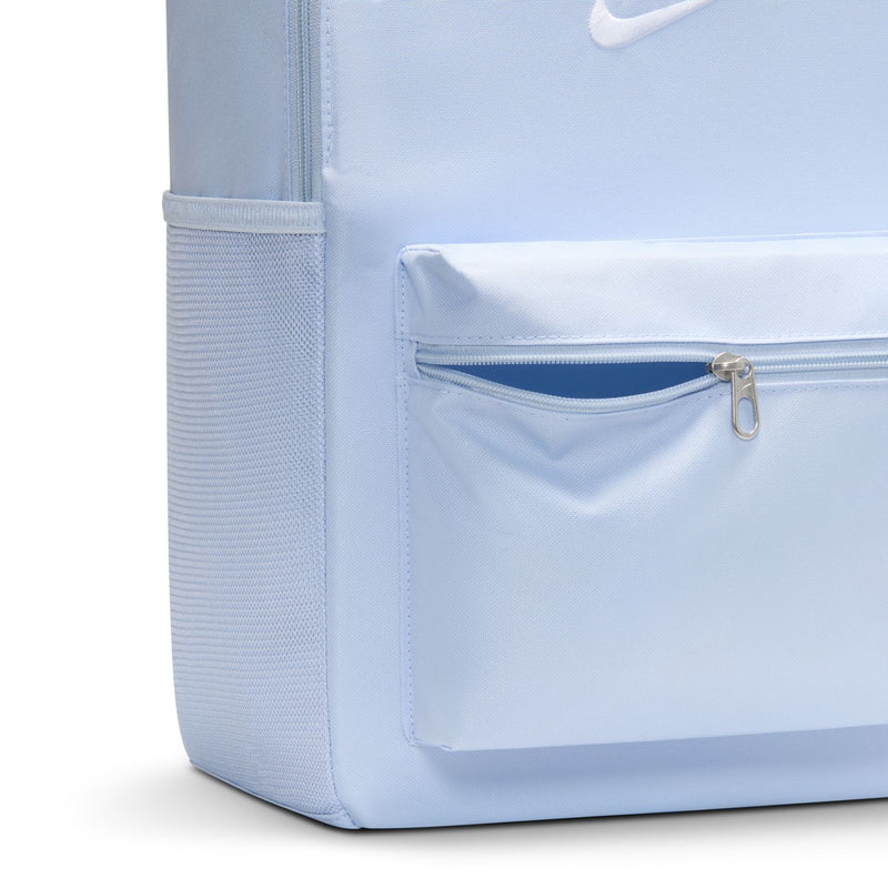 Light blue Nike backpack front pocket with silver zipper and logo patch