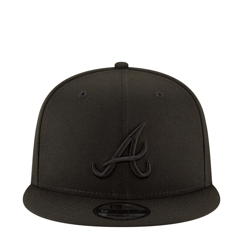 Black baseball cap with embroidered front logo and flat brim