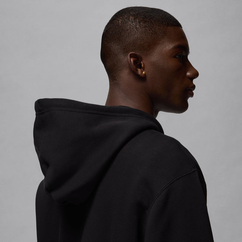 Black hoodie back view, full-zip style with hood and stitched seams.