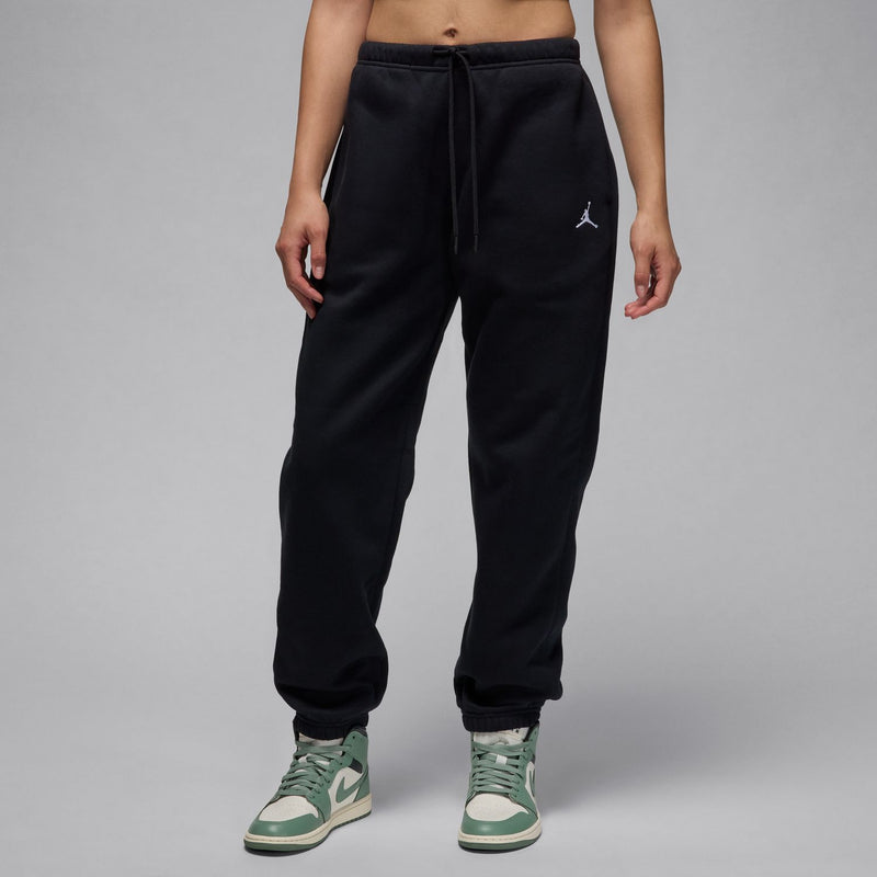 Women's black fleece sweatpants with drawstring waistband and small side logo on left leg
