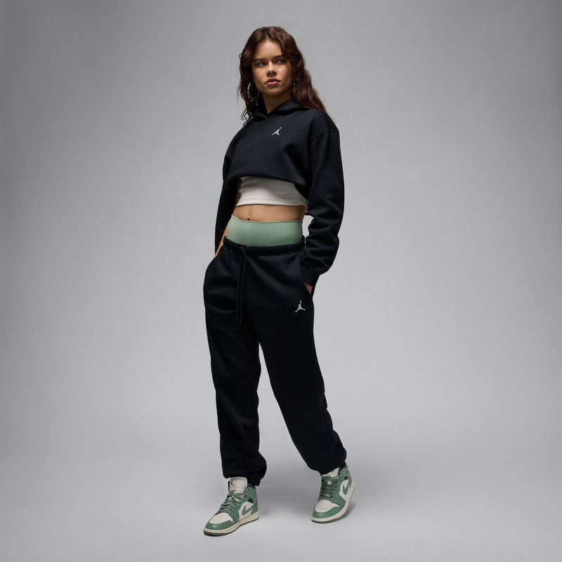 Women's black fleece jogger sweatpants with embroidered side logo and tapered ankle cuffs