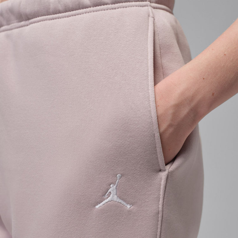 Dusty rose fleece pants with Jumpman logo on side and drawstring waist