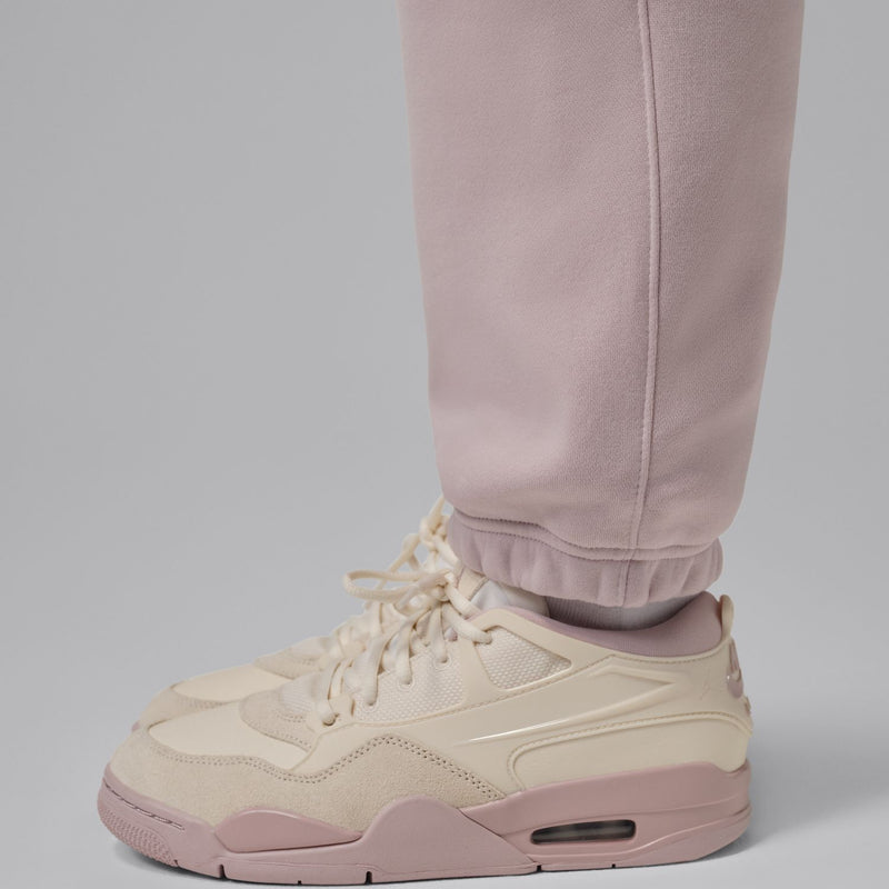 Dusty rose fleece pant cuffs with drawstring tie, close-up